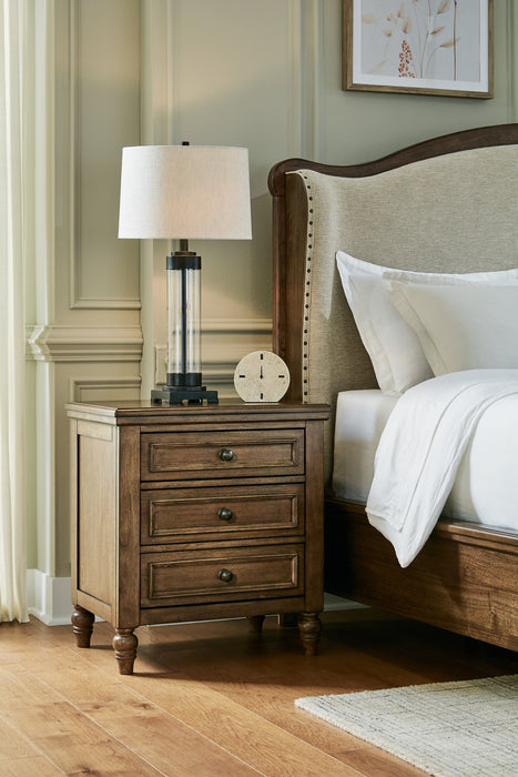 Sturlayne California King Upholstered Panel Bed with Mirrored Dresser, Chest and Nightstand